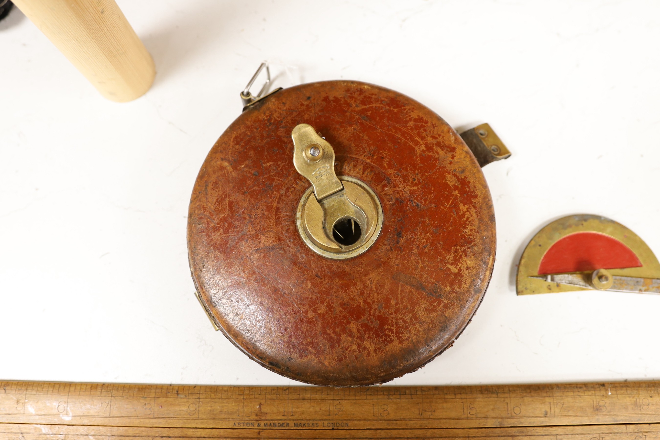 Two Aston & Mander rulers, a Chesterman tape measure and a protractor